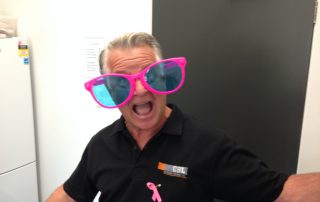 Business manager Peter in oversized pink glasses