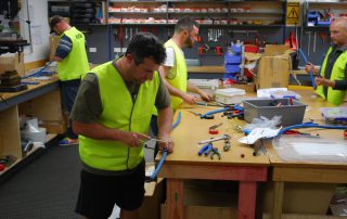 Students working around the workbench