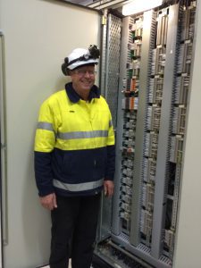 John Peters from Contact Energy in front of one of controls panels full of Weidmuller terminals.